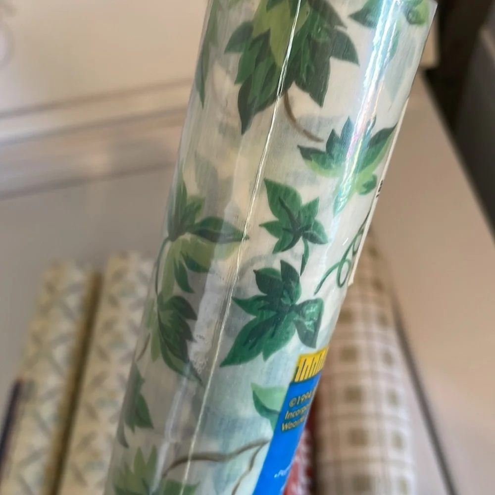 Five rolls of Rubbermaid shelf liner, some adhesive some not 3 full new rolls